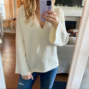 White v-neck sweater with bell sleeves